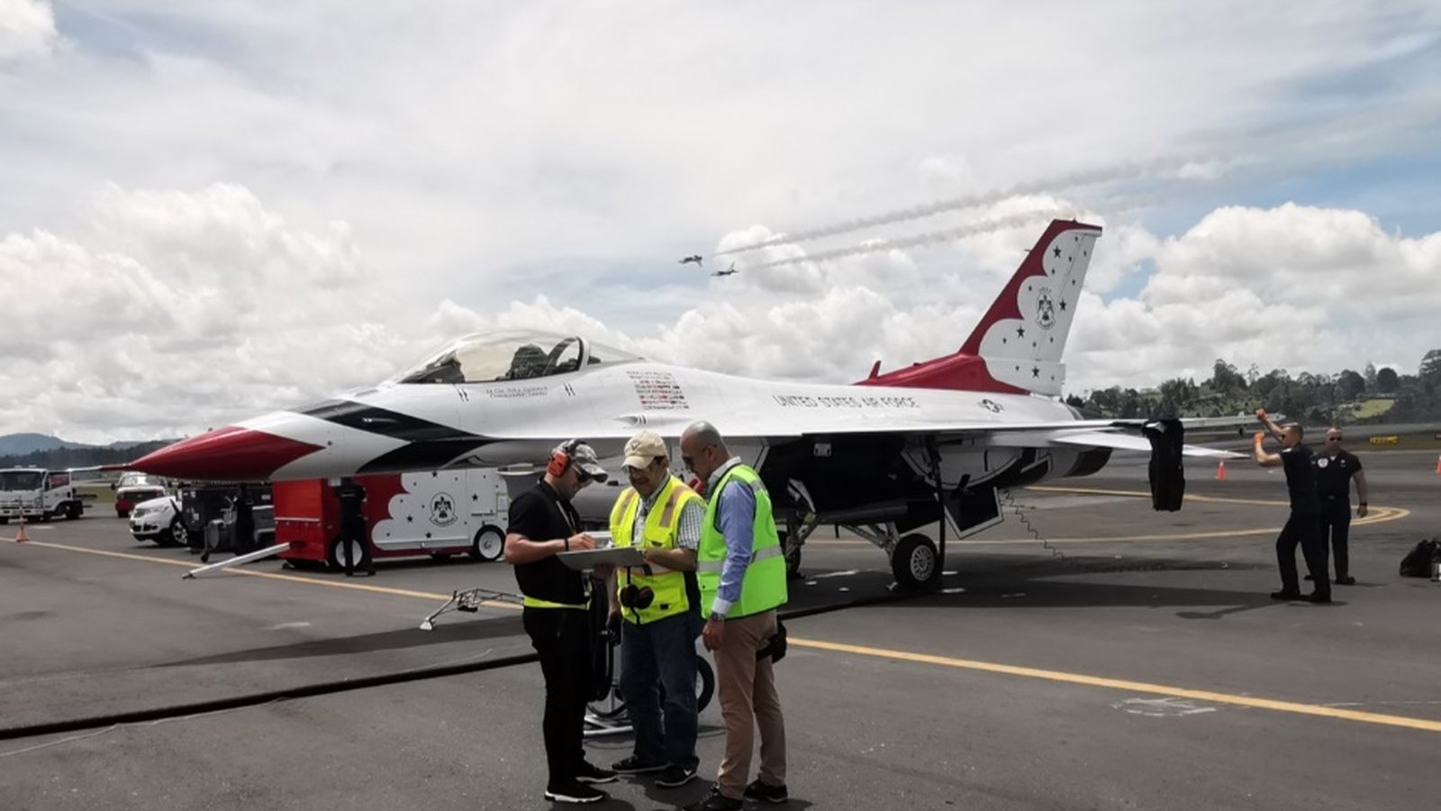Colombian Air Force fighter jets on the ramp with Aerofull ground crew